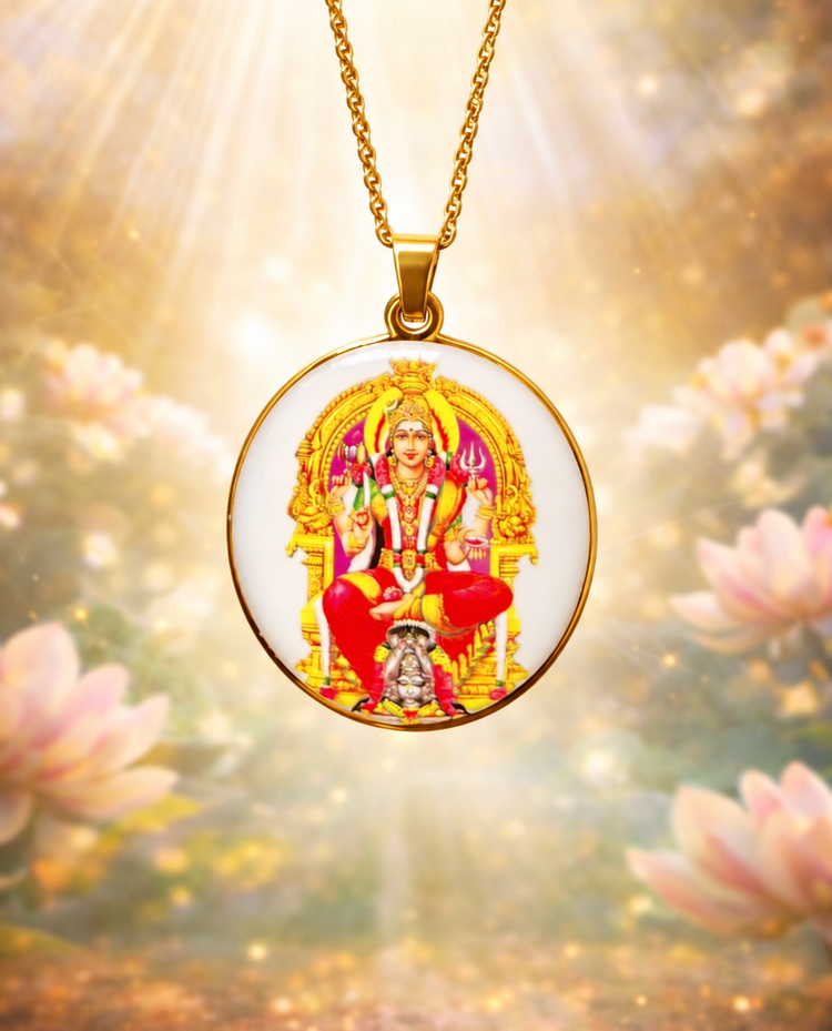 Circular devotional pendant showing a seated goddess in red